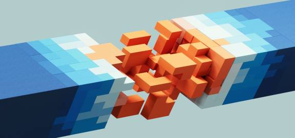 orange, white, and blue blocks being built